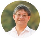 The image shows a person wearing a white shirt against a backdrop of green foliage.

AI-generated content may be incorrect.